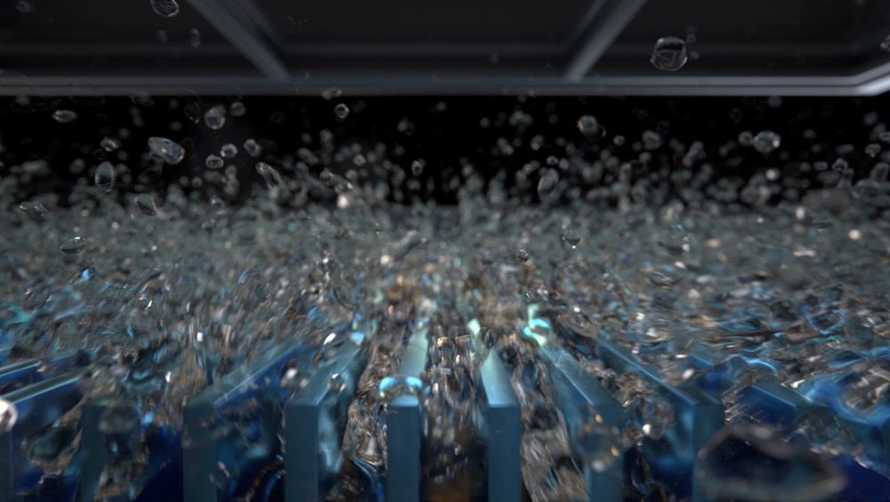 삼성 버블워시 — 드럼 내부에서 미세 거품이 폭포처럼 쏟아지는 모습. 세제를 물+공기와 먼저 섞어 거품으로 만든 뒤 옷감에 침투시킨다